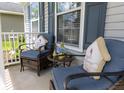 Cozy front porch featuring comfortable seating and charming decor elements at 186 Two Pond Loop, Ladson, SC 29456