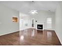 Spacious living room featuring wood floors, a fireplace, and a ceiling fan at 2520 Woodstream Rd, Mount Pleasant, SC 29466