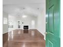 Bright living room boasts hardwood floors, a fireplace, vaulted ceiling, and lots of natural light at 2520 Woodstream Rd, Mount Pleasant, SC 29466