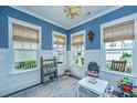 Bright playroom with blue wallpaper, white trim, and large windows offering natural light at 2962 Clearwater Dr, Mount Pleasant, SC 29466