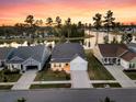 Beautiful aerial shot of homes near a serene lake, showcasing lush greenery and peaceful surroundings at 327 Tupelo Lake Dr, Summerville, SC 29486