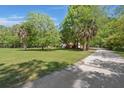 Picturesque home set back on a large lot with long driveway and mature trees at 3756 Colonel Vanderhorst Circle, Mount Pleasant, SC 29466