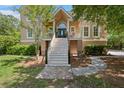Charming front porch with stairs welcomes you to this lovely home at 3756 Colonel Vanderhorst Circle, Mount Pleasant, SC 29466