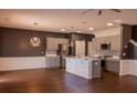 Bright, modern kitchen with an island, stainless steel appliances, and an open floor plan at 4916 Paddy Field Way, Ladson, SC 29456