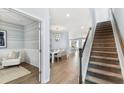 Inviting foyer featuring beautiful hardwood floors, stairs, and light-colored walls, creating a bright and welcoming space at 538 Verdi Dr, Summerville, SC 29486