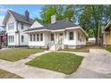 This single-story home offers well-manicured landscaping, and a inviting front door at 1014 Alamo St, North Charleston, SC 29405