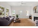 Bright living room featuring hardwood floors, neutral decor, and a cozy seating arrangement at 1014 Alamo St, North Charleston, SC 29405