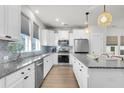 Modern kitchen featuring granite countertops, stainless steel appliances, and bright natural lighting at 105 Archdale St, Summerville, SC 29486