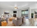 Bright living room featuring stylish furniture, a fireplace, and sliding glass doors that provide ample natural light at 108 Greenmeadow Dr, Goose Creek, SC 29445