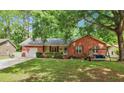 Traditional brick home with a welcoming front porch, swing, and well-manicured lawn at 109 Williams Ct, Goose Creek, SC 29445