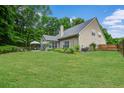 Spacious backyard with lush green grass and mature trees at 113 Ashton Cv, Summerville, SC 29485