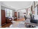 Bright living room with hardwood floors, comfortable seating, and arched doorways at 113 Ashton Cv, Summerville, SC 29485