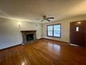 Bright living room features wood floors, a fireplace, and natural light at 113 Germantown Rd, Summerville, SC 29483