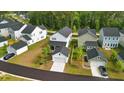 Birds-eye view of a neighborhood with tree-lined streets and modern homes at 117 Osprey Ridge Ln, Summerville, SC 29483