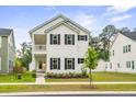 Beautiful two-story home with a cozy porch and well-maintained yard at 117 Osprey Ridge Ln, Summerville, SC 29483