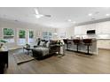 Open-concept living area featuring a comfortable sofa, modern décor, and a seamless connection to the kitchen at 1221 Lois Allen Rd, Johns Island, SC 29455