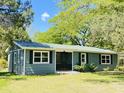 Exterior of the home featuring a new roof, paint, landscaping and a view of the home number at 1425 Risher Mountain Rd, Walterboro, SC 29488
