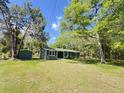 Inviting single-story home with mature landscaping and a well-maintained green lawn at 1425 Risher Mountain Rd, Walterboro, SC 29488
