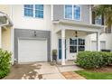 Charming townhome featuring a well-manicured front yard and attached garage at 151 Kirkland St, Goose Creek, SC 29445
