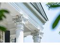 Close-up of the ornate architectural details and Corinthian columns that add character to the exterior at 172 Tradd St, Charleston, SC 29401