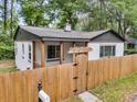 Charming cottage with fenced yard and inviting entry gate at 1790 Brockington Ave, Charleston, SC 29407