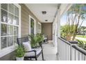 Cozy porch with rocking chairs, plants, and views of the surrounding greenery, perfect for relaxing at 1985 Shields Ln, Mount Pleasant, SC 29466