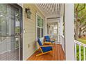 Inviting front porch with cozy seating, perfect for relaxing and enjoying neighborhood views at 2948 Treadwell Street St, Mount Pleasant, SC 29466