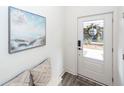 Bright entryway with beachy art, comfortable seating and stylish decor providing an inviting space at 305 Flowering Peach Ct # 202, Charleston, SC 29414