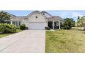 Traditional home featuring a manicured lawn and a two-car garage with ample parking at 318 Oyster Bay Dr, Summerville, SC 29486