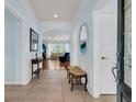 Welcoming foyer features tile floors, blue walls, and views into the spacious living room at 318 Oyster Bay Dr, Summerville, SC 29486