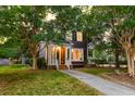 Inviting two-story home with lush landscaping and a welcoming front entrance at 321 Bounty Ln, Charleston, SC 29412