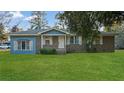 Charming single-story home with blue and brick exterior and well maintained lawn at 33 Elliott Ct, Walterboro, SC 29488