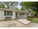 Attractive single-story home showcasing a covered front porch and a well-manicured yard at 344 Lantana Dr, Charleston, SC 29407
