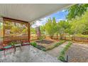 Relaxing covered porch offering an outdoor space with seating, a view of the landscaped yard, and a cozy atmosphere at 4546 Holly St, North Charleston, SC 29405