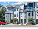 Contemporary townhome exterior featuring modern design and neutral color palette at 4585 Summey St, North Charleston, SC 29405