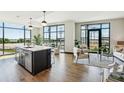 Bright, open floor plan with modern kitchen island and comfortable living area with natural light at 5 Gadsdenboro St # 204, Charleston, SC 29401