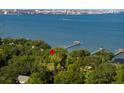 Aerial view of waterfront property with private piers and mature landscaping at 528 Wampler Dr, Charleston, SC 29412