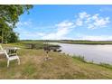 A beautiful backyard features a deck leading into the waterway and an area to sit and enjoy the nature at 6240 Old Point Rd # C-8, Hanahan, SC 29410