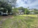 Quaint two-story home with a spacious front yard offering plenty of room to relax and enjoy the outdoors at 759 Powhatan Ave, Mount Pleasant, SC 29464