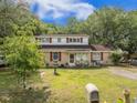 Charming two-story home featuring a well-manicured lawn and beautiful landscaping at 759 Powhatan Ave, Mount Pleasant, SC 29464