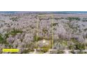 Approximate boundary lines highlighting the acreage of a secluded property with a charming home nestled among trees, offering privacy and space at 8476 Old Georgetown Rd, McClellanville, SC 29458
