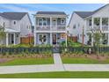 Charming two-story home with a welcoming front porch and second story balcony at 886 Clay Field Trl, Summerville, SC 29485