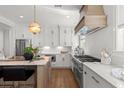 Updated kitchen with stainless steel appliances, white cabinets, and a large island at 9822 Haven Loop, Johns Island, SC 29455