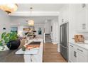 Kitchen island with stainless steel sink and stainless refrigerator at 9822 Haven Loop, Johns Island, SC 29455