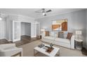 Cozy living room featuring a comfortable couch, stylish art, and a view into another room at 130 River Landing Dr # 4102, Charleston, SC 29492