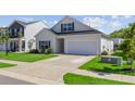 Charming two-story home with a well-maintained lawn, a garage, and a classic architectural style at 134 Percheron Dr, Summerville, SC 29486
