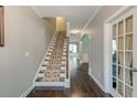 Elegant hallway with hardwood floors and a staircase leading to the upper level at 149 Daniels Ridge Dr, Summerville, SC 29485