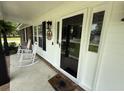 Inviting porch with rocking chairs, stylish front door, and charming decor details at 1606 Waterside Blvd, Moncks Corner, SC 29461