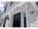 Elegant front door with decorative molding and black accents, adding a touch of sophistication at 19 Ashley Ave, Charleston, SC 29401