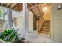 Exterior staircase detail with wood steps, leading to upper-level units at 2121 Egret Crest Ln, Charleston, SC 29414